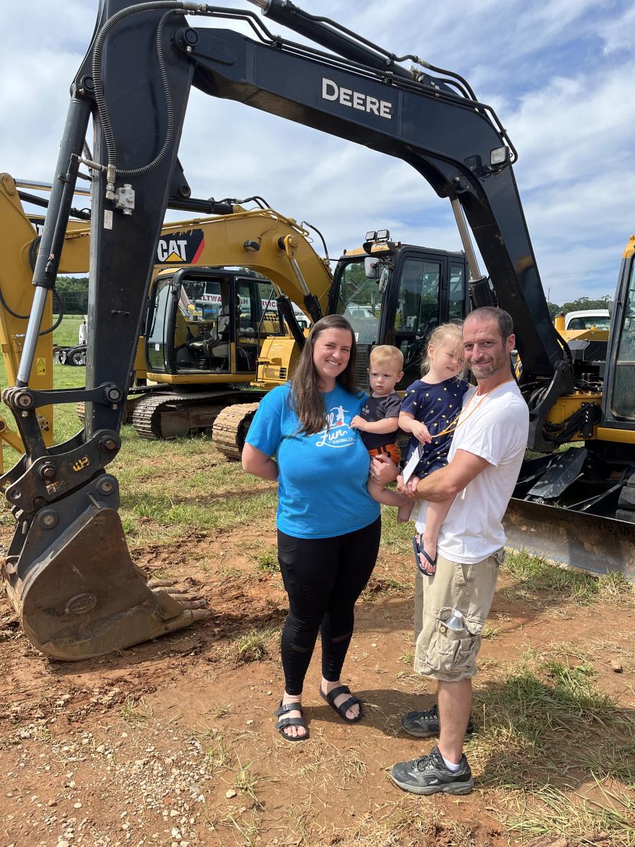 Kat and Chris Wilkinson of Wilkinson Construction in Mooresville, N.C., brought their children, Wyatt and Skylar, to the auction. They were hoping to get the 2008 Cat 311 excavator to use on a current project. (CEG photo)