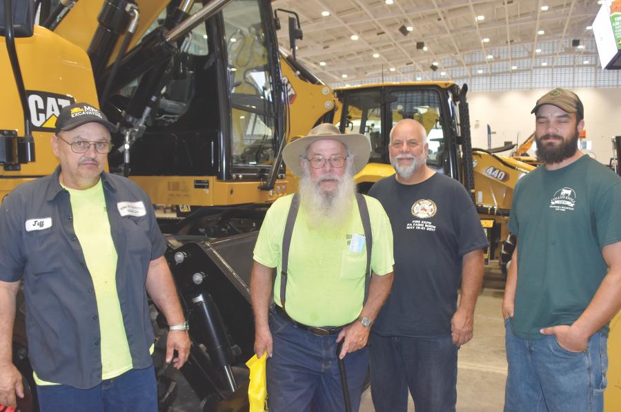 The town of Litchfield in Herkimer County was ready to drive home this Caterpillar wheeled excavator until simple math told them it might take a little more time than they had available. (L-R) are Jeff Pope; Clifford Coffin, highway superintendent; John Coy; and Jerry Wheelock.
(CEG photo)
