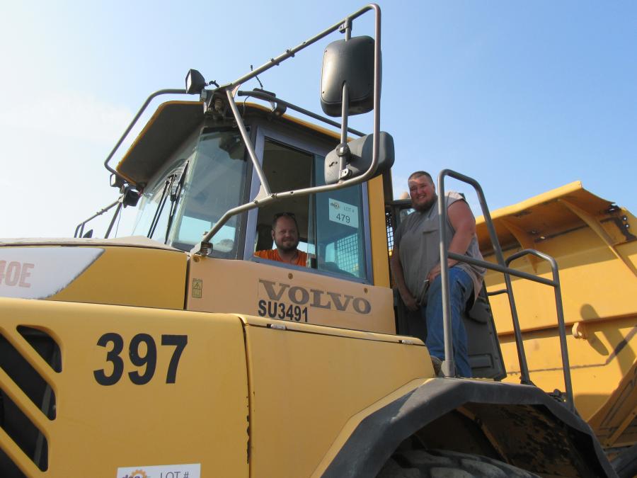 Andrew Hicks (L) and Clint Westcott of W3 Heavy Equipment and Repair give this Volvo A40E articulated dump truck the once over. (CEG photo)