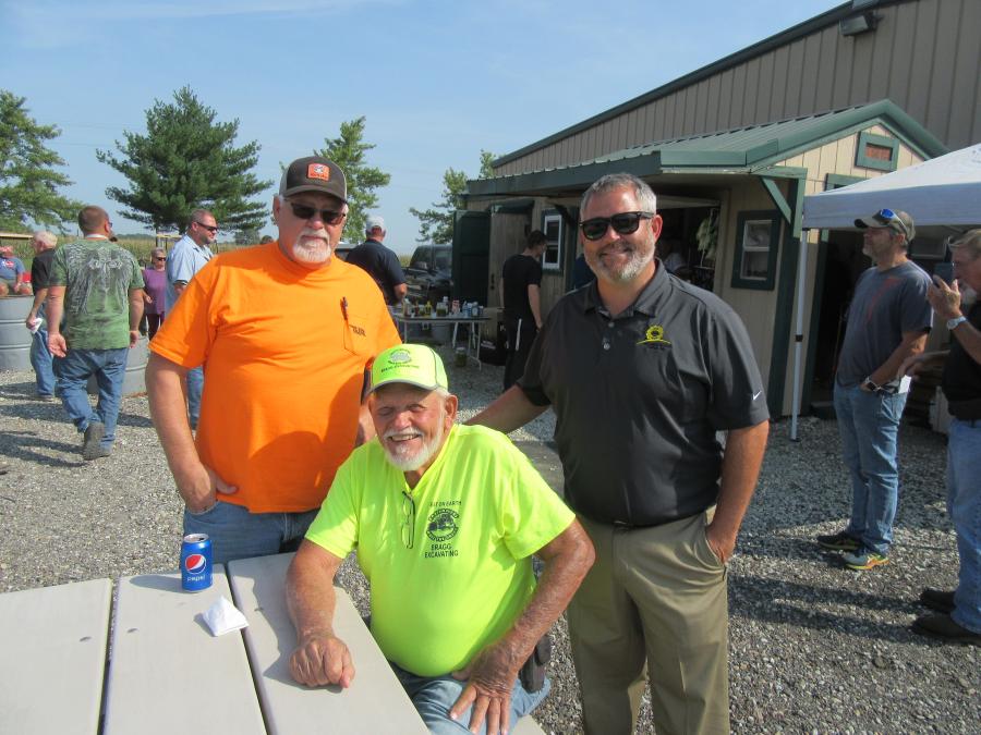 (L-R): Tom Riddle of TJR Equipment and Dick Bragg of Bragg Excavating are welcomed by Don Smock Auction Company President Nic Smock. (CEG photo)