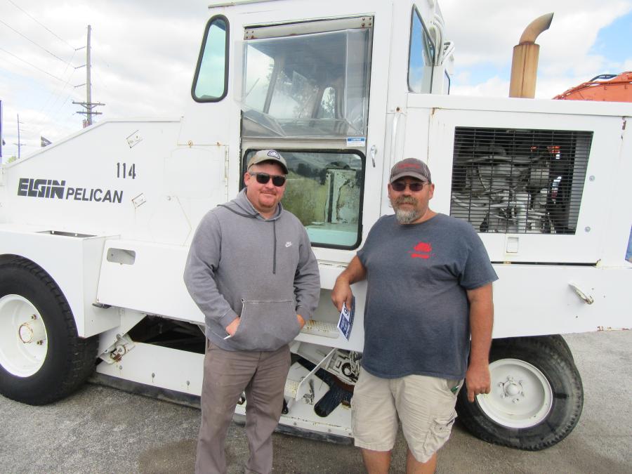 Tim McVey (L) of Tops Towing — who purchased this Elgin street sweeper and a few more items at the auction — joined Andy Conover of Goodwill Transport, Fleet Service & Repair.
(CEG photo)
