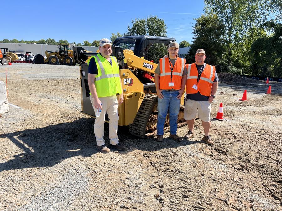 (L-R): Julio Vargas of Carolina Cat goes over the Cat 249D3 compact track loader with Jacob and Jay Ervin, both of F.J. Ervin Construction in Mooresville, N.C.
(CEG photo)