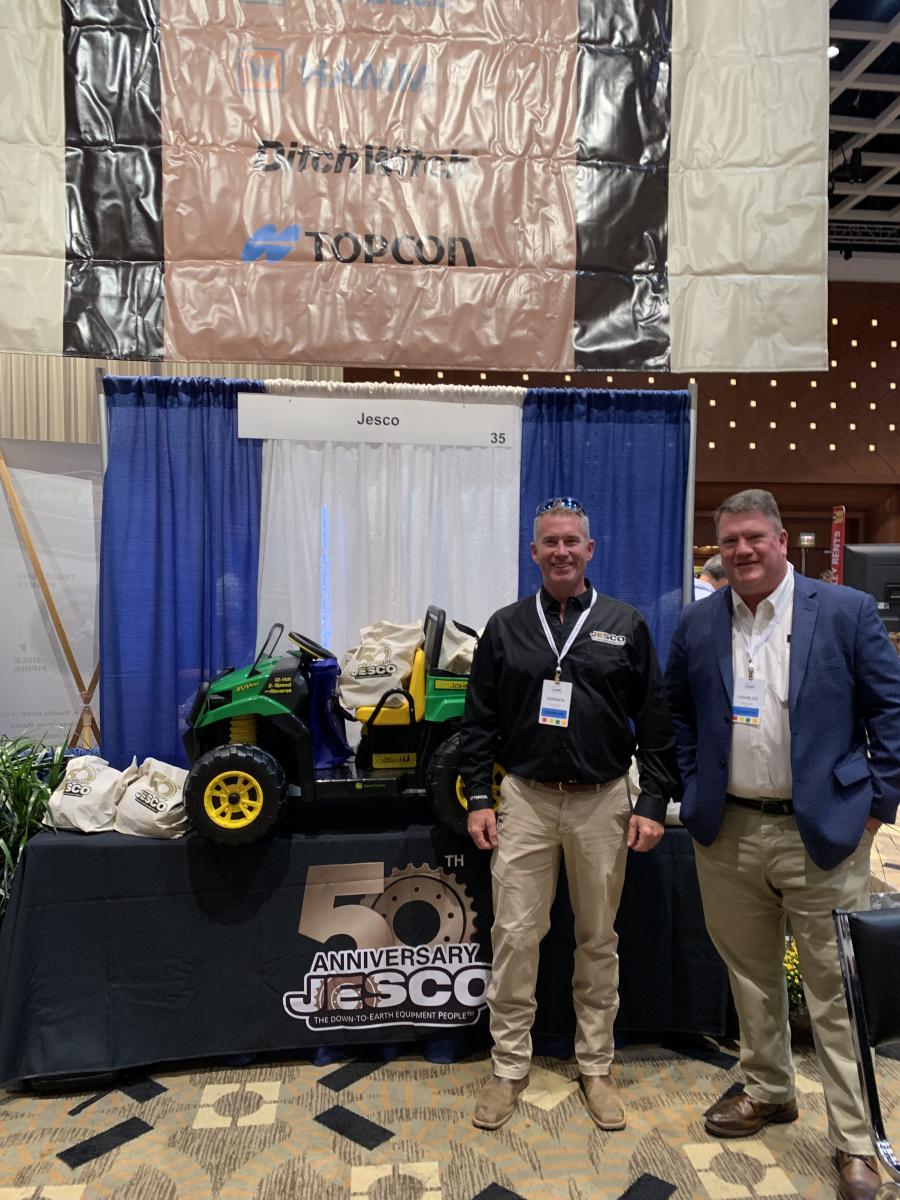 JESCO, which is celebrating its 50-year anniversary, raffled off a John Deere model XUV550 for one lucky attendee. Derrick Ward (L) and Charles Dull pose in front of the giveaway. (CEG photo) 