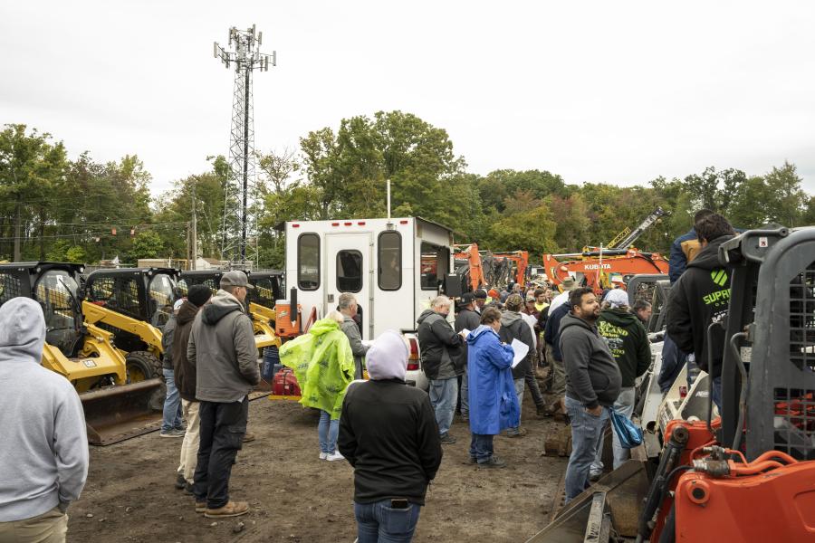 Attendees bidding on the various skid steers offered at Sales Auction Company’s largest sale to date. (CEG photo)