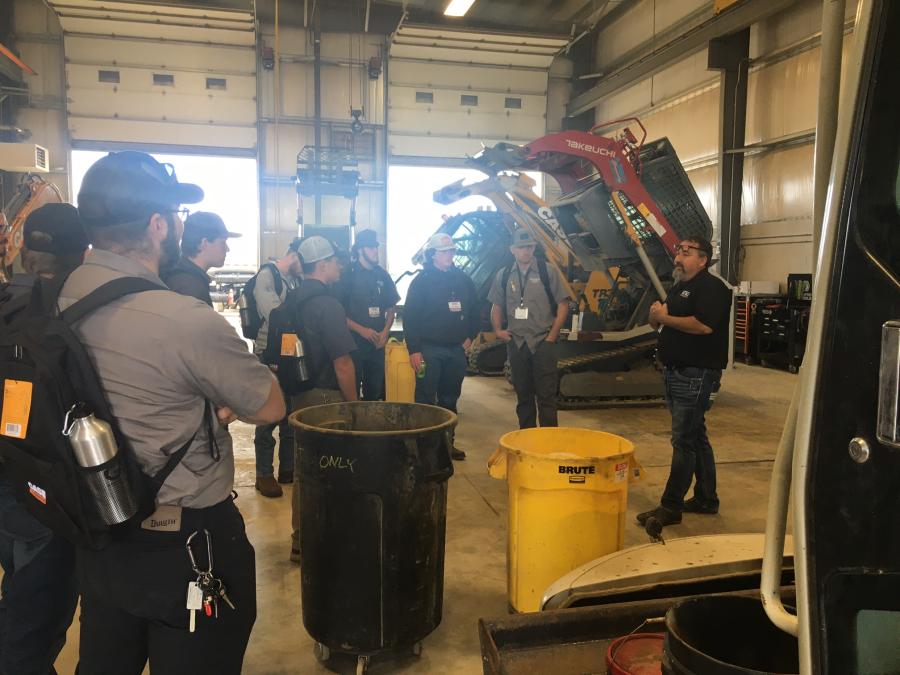 Jeremy Helm, regional service manager of Groff Tractor & Equipment, leads a group of Pennsylvania College of Technology students through the service area.(CEG photo)