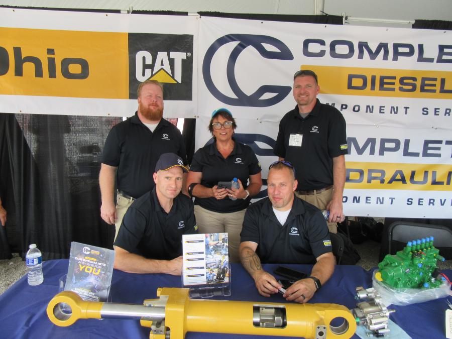 Janie Hovan (C), Ohio CAT’s general manager, component remanufacturing division, joined Ohio CAT division Complete Hydraulic’s Mark Kauffung (L, standing), Mike Watt (L, sitting), Donald Norris (R, sitting) and Complete Diesel’s Derek Simon (R, standing) to discuss the division’s line of new and remanufactured parts and components.
(CEG photo)