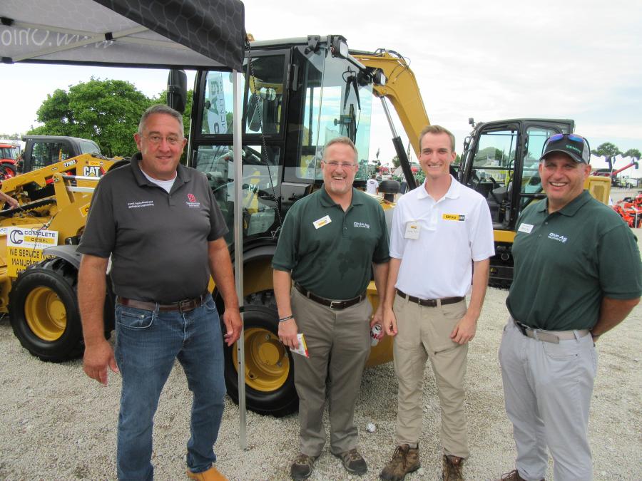 (L-R): Scott Shearer, Ohio State University chair, department of food and bioengineering, caught up with Ken Taylor, Ohio CAT president and owner, Ken’s son, Gordon Taylor, and Mike Mampieri, Ohio CAT general manager, Agg division. 
(CEG photo)