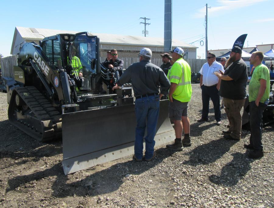 Case Sales Specialist Marc Hauser runs through the Minotaur DL550 compact dozer loader’s operating controls and capabilities at the event.
(CEG photo)