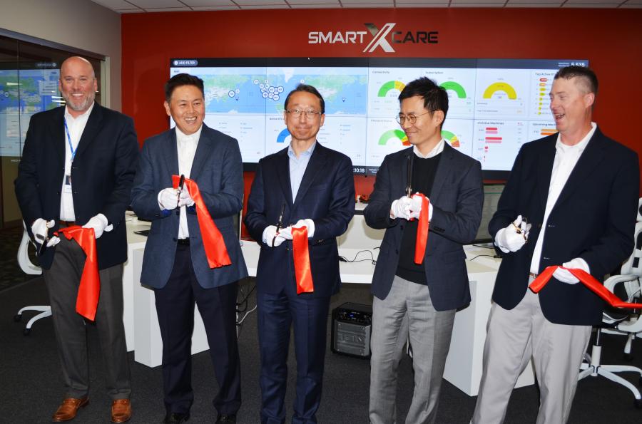 (L-R): Todd Roecker, vice president of growth initiatives; Edward Song, CEO of Doosan Infracore North America; Young Cheul Cho, CEO of Hyundai Doosan Infracore; David Kam, director of sales planning & business development; and Zach Stallings, director of parts & service, all cut the ceremonial ribbon for the new Doosan Machine Monitoring Center where the company launched an enhanced, subscription-based telematics monitoring service called Smart X-Care. (CEG photo)