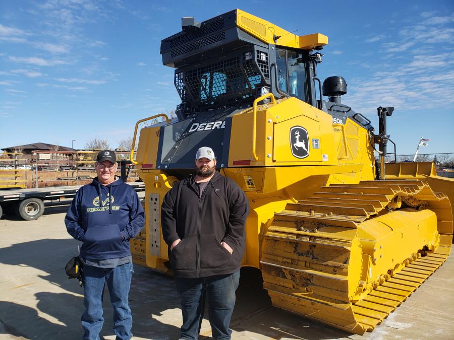Dale Berry (L) and Justin Nulik, both of M&B Dozing, were looking over this John Deere 950K dozer. (CEG photo)