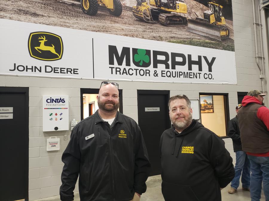 John Deere’s Steven Gibbs (L) and Aaron Dillon of Engcon met up during the open house. (CEG photo)
