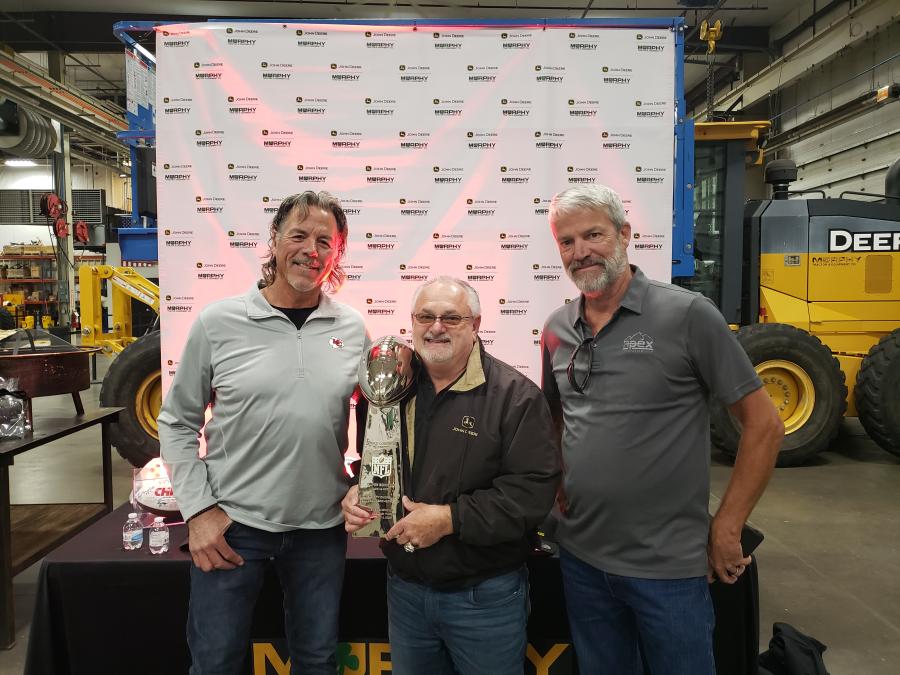Former Kansas City Chief Mike Bell (L) brought the Lombardi Trophy to the Murphy Tractor open house. Bell played from 1979-91 and his nephew, Blake Bell, is currently playing with the Chiefs. With Bell are Travis Kelly (C) and Dan Heddin of Apex Excavating. (CEG photo)