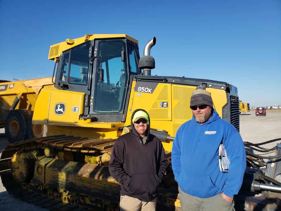 Cody Taylor (L) of Cat Contracting and Josh Kilgore of S.W. Line Contracting were interested in this John Deere 850K crawler dozer. (CEG photo)