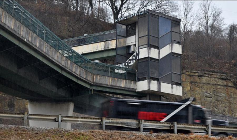 The walkway, closed in the early 1990s due to safety concerns, is part of a bridge over the freeways and features a series of enclosed stairs, towers and walkways. (Photo courtesy of West Virginia Department of Transportation)