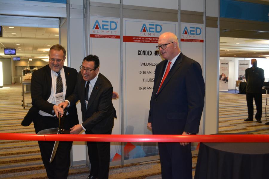 (L-R): AED’s Ken Taylor, past chairman (Ohio Cat); Matt Dilorio, incoming chairman (Ditch Witch Mid-States); and Brian McGuire, president/CEO, cut the ribbon to open the AED Summit/CONDEX.
(CEG photo)