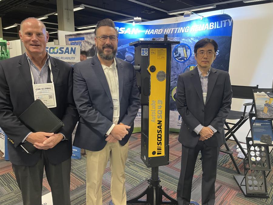 Soosan Heavy Industries displayed the AutoLube SQ43 hammer. (L-R) are Greg Henry, director of sales and marketing; Joe Grojean, central region sales manager; and Sung-Jong Kee, managing director.
(CEG photo)