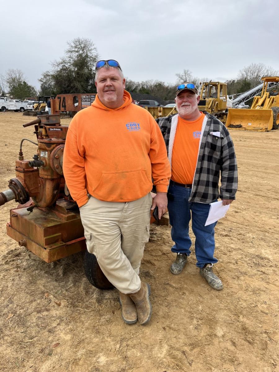 David (L) and Brian Cody, both of Darrell Cody & Sons Grading in Richfield, N.C., came to bid on the excavators, loaders and scissor lifts.
(CEG photo)