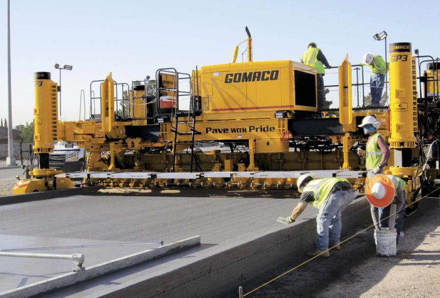 Equipped with a 5000 series paving mold, this GP3 four-track slipforms 26 ft. wide with integral curb on both sides of the slab.