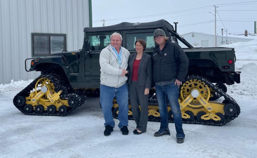 (L-R): Glen Brazier, Mattracks founder and CEO; U.S. Sen. Amy Klobuchar; and Matt Brazier, Mattracks special operations coordinator and original concept creator, stand in front of a Mattracks equipped vehicle on Jan. 11, 2023.