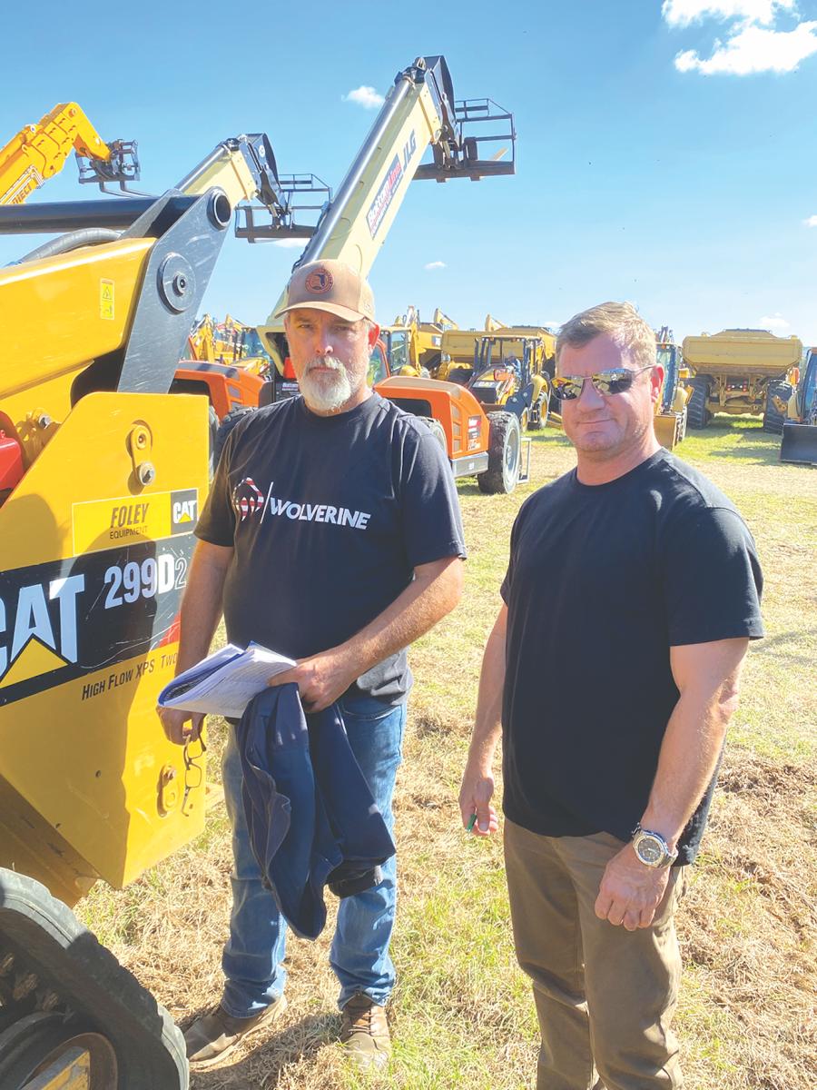 Business is booming in Florida, and local contractors need equipment. Checking out a Cat 288D compact track loader are the owners of One Golf, a golf course contractor in Ocala, Fla.
(CEG photo)