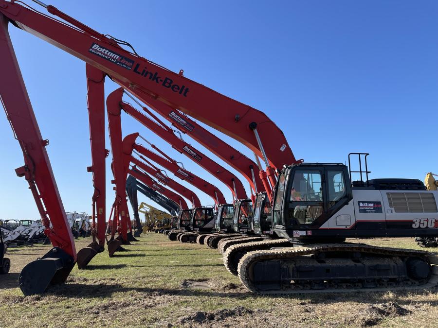 Long-reach excavators are lined up and ready for an auctioneer. 
(CEG photo)