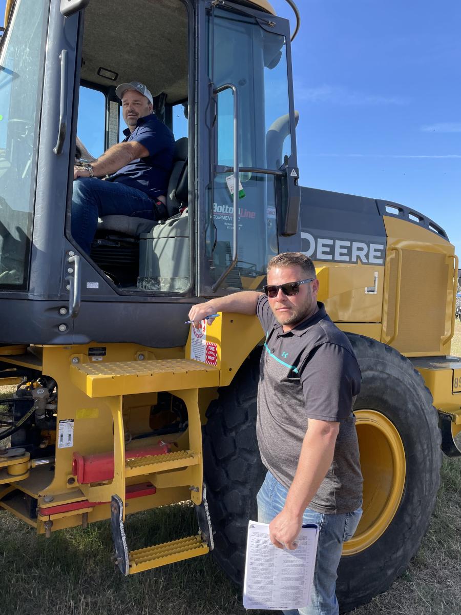 Irv Rupersberg (in cab) and Jeff Beck, both of Dan’s Excavating Inc., Shelby Township, Mich., check out this John Deere 544K wheel loader.
(CEG photo)