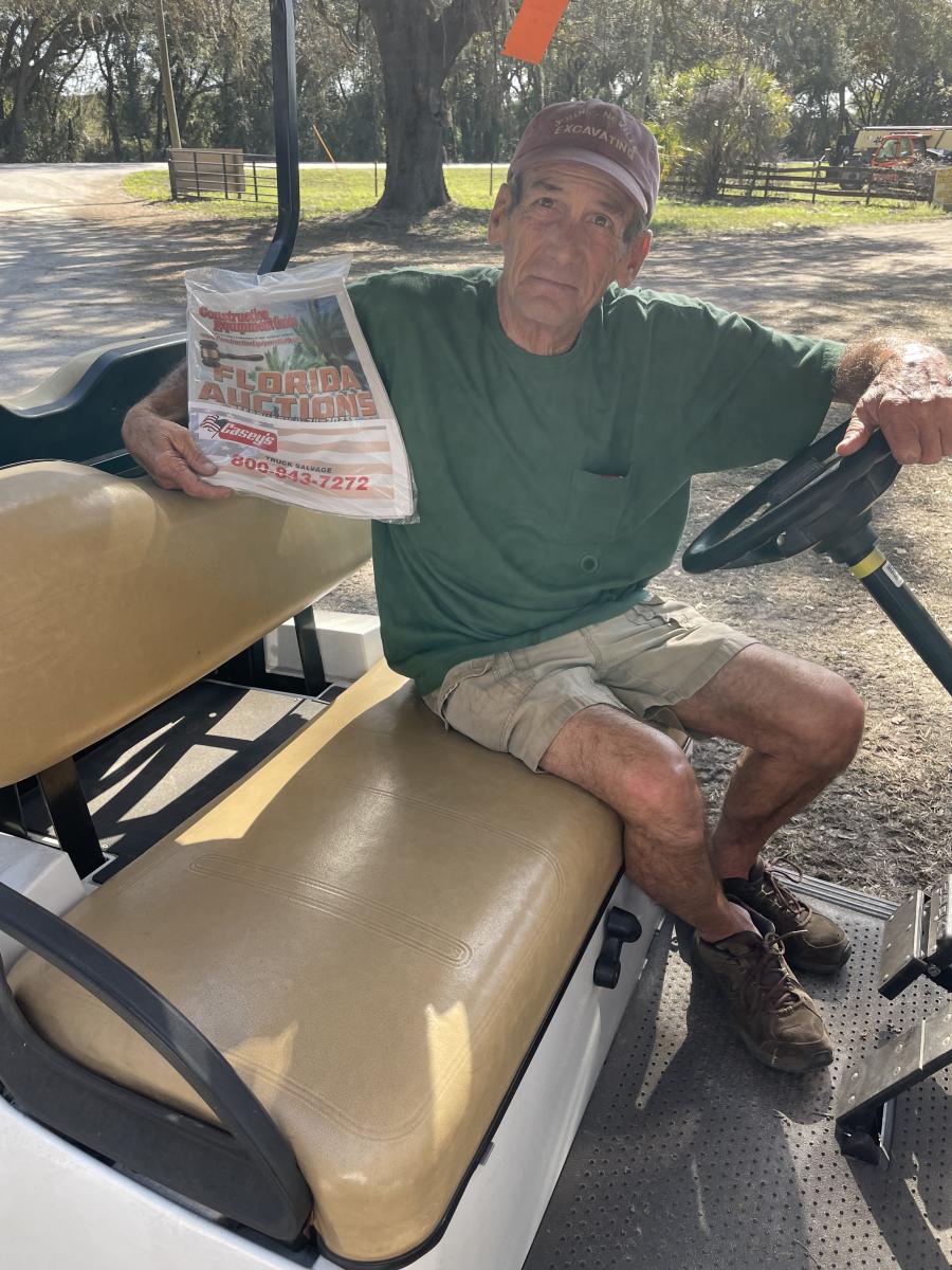 John Neville of John E. Neville Excavating, based in Goffstown, N.H., gets ready to read CEG’s Florida Auction supplement.
(CEG photo)