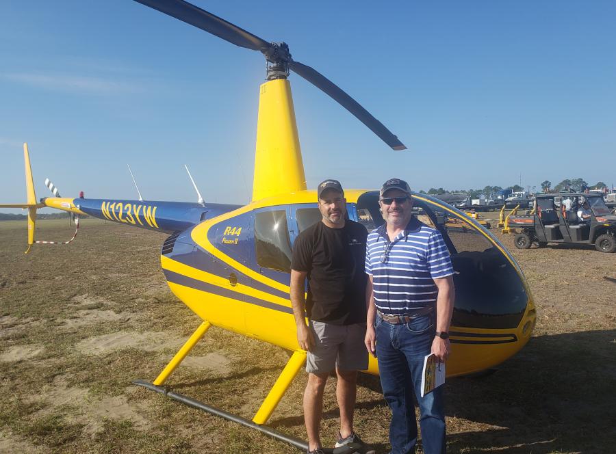 Ed Maxwell (L) of Maxwell Trucking and Excavating, State College, Pa., and Mike Lester of Groff Tractor made it to Alex Lyon & Son’s auction in style, via a Robinson R44 Raven II helicopter.
(CEG photo)