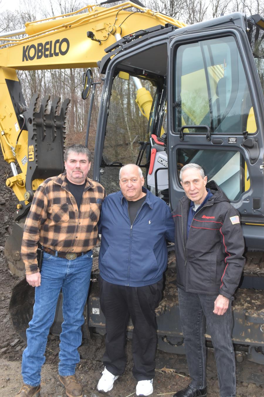 (L-R): Dennis Gallagher Sr., Westchester Tractor; John Maxner, Maxner Landscaping; and Frank Labarbera, retired from Westchester Tractor, alongside a Kobelco SK210 excavator.
(CEG photo)