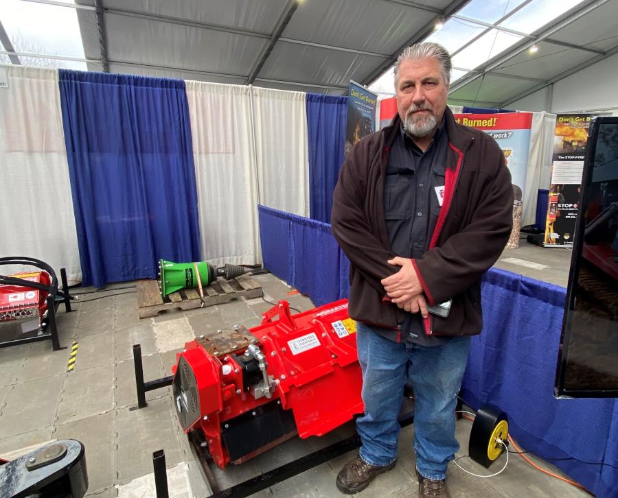 GF Equipment Sales Representative Tom Lane stands with the Vh110 Simatech.
(CEG photo)