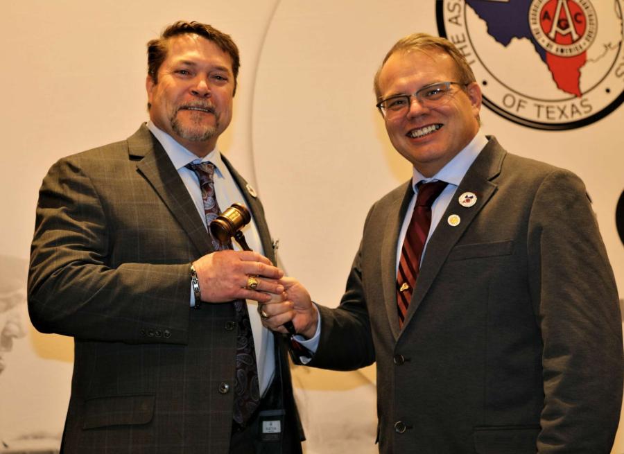 Stacey Bryant (L), principal and general manager of Jones Bros. Dirt and Paving Contractors, was installed as president of the Associated General Contractors of Texas during a ceremony at the Hyatt Regency in Austin. Bryant accepts the leadership gavel from 2022 AGC President David Casteel.
(AGC of Texas photo)