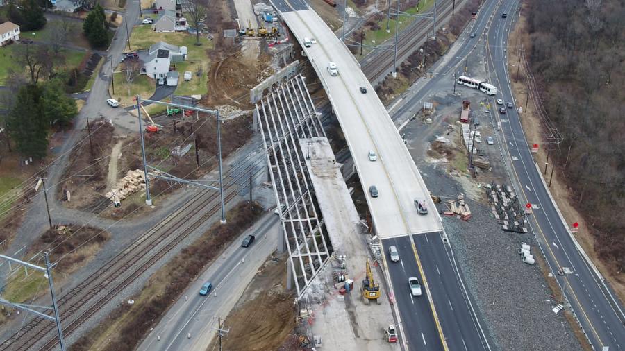 A new U.S. 1 bridge is being constructed over an active railroad. Note the power lines overhead. Workers provided support for reconfiguring the power lines as a part of the project.
(Photo courtesy of PennDOT.)