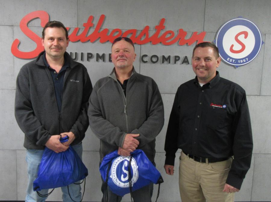 (L-R): Adam Cameron and Lenny Martz of Catholic Cemeteries caught up with Mike Kress, Southeastern Equipment Company sales representative.
(CEG photo) 