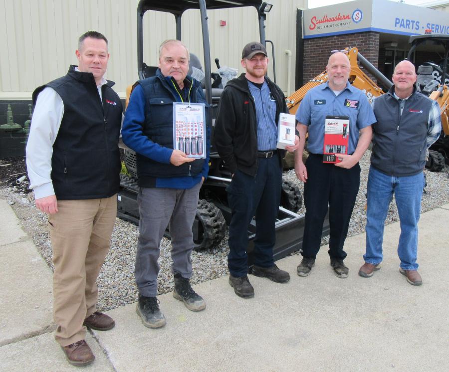 Chris Kurz (L) regional sales manager of Southeastern Equipment Company, and Mathew Helderman (far R) operations manager, present door prizes to (L-R) Bill McLellan of Northern Ohio Excavating and Grading, Justin Cubbison of the city of Bedford and Paul Magovac of Brunswick Hills Township service department.
(CEG photo) 