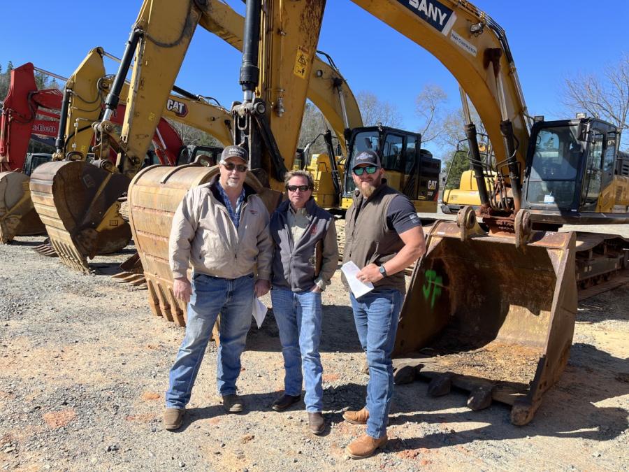 (L-R): Sammy Flower of S.J. Flow Grading in Midland, N.C., and Anthony Broome and Russell Griffin, both of The Ironpeddlers in Monroe, N.C., looked over the wide variety of excavators up for bid.
(CEG photo)