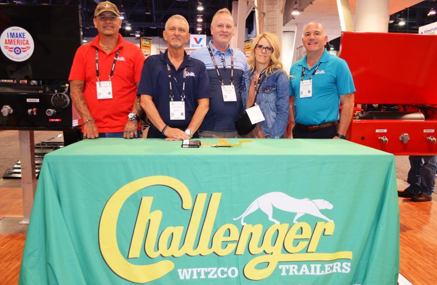 Big trailers from Witzco Challenger were directly in the center of North Hall and representatives and dealers were on hand to promote the line. (L-R) are Shami Jimenez; Jeff Schatz, of Witzco Challenger; Mike and Jennifer Tilley of Budget Truck Center, Heyburn, Idaho; and Josh Weinstein, president of Witzco Challenger. 