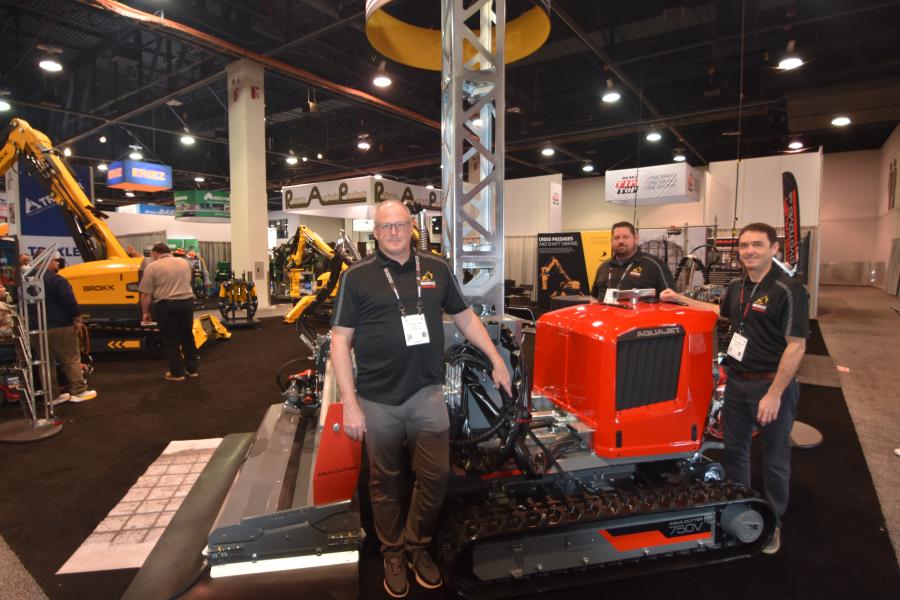 The Brokk and Aquajet team in front of the Aqua Cutter 750V, Aquajet's newest Hydrodemolition robot perfect for a wide variety of concrete removal tasks, such as renovation and bridge and road repair. (L-R) are Jeff Keeling, vice president of sales and marketing of Brokk Inc.; Keith Armishaw, business development manager of Aquajet North America; and Troy Steele, regional sales manager, Brokk Inc. 