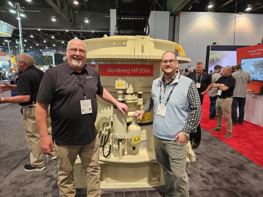 John Genger (L) of Metso Outotec explains the benefits of this Nordberg HP 200 E cone crusher to Doug Sites of Thompson Machinery in La Vergne, Tenn. 