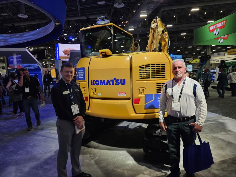 Jason Kollros (L) of Komatsu answered questions about the latest Komatsu products asked by John Caporale of JC Land and Sight Development of Ossining, N.Y. 