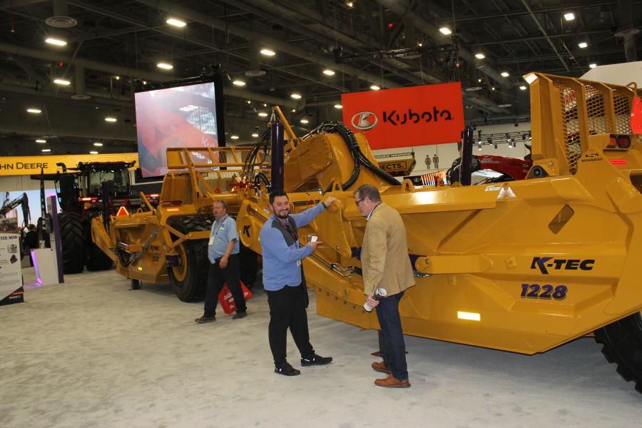 Brian Nuffer (L) of Whelen Engineering Corporation in Chester, Conn., and Scott Nelson of GS Global Resources in Mukwanago, Wis., looked over this K-Tec tandem scraper with a Case tractor.  