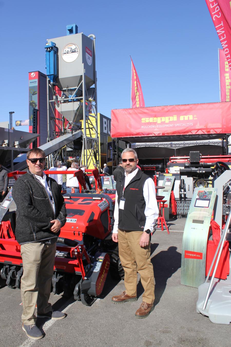 Tom Ledin (L) Abra Equipment, Fort Meyers, Fla., and Ben Carlson, sales manager of Seppi North America, with the Seppi Max 50, a remote-controlled carrier with forestry mulcher. 