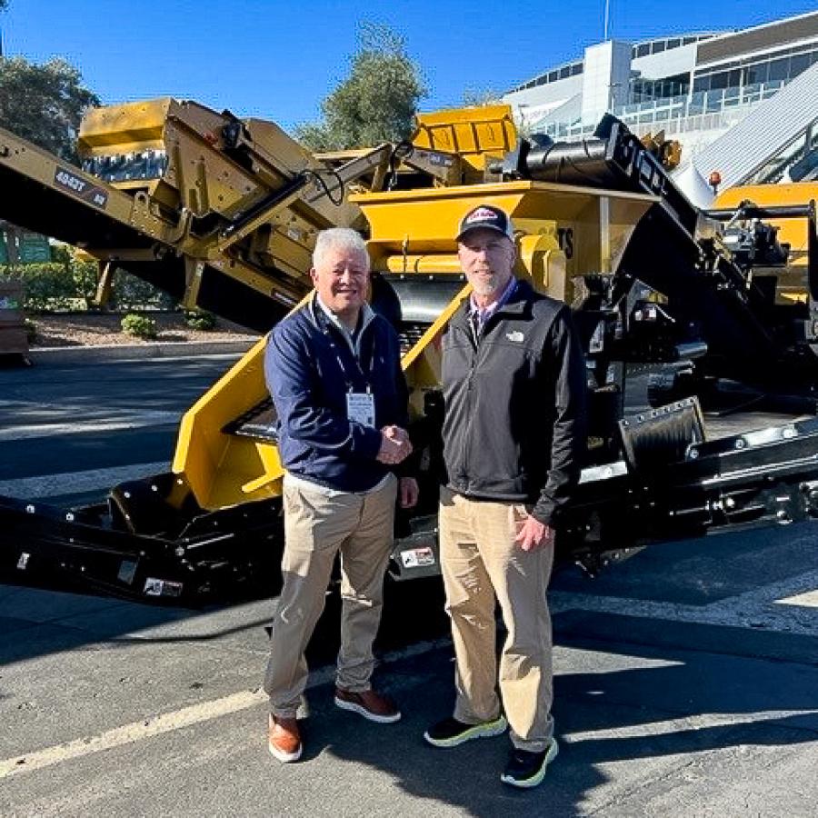 John Lamprinakos (L), president and CEO of Screen Machine and Tim Gerbus, product and sales manager of Taylor Construction Equipment with a SMI 90TS, compact track screening plant at ConExpo 2023.