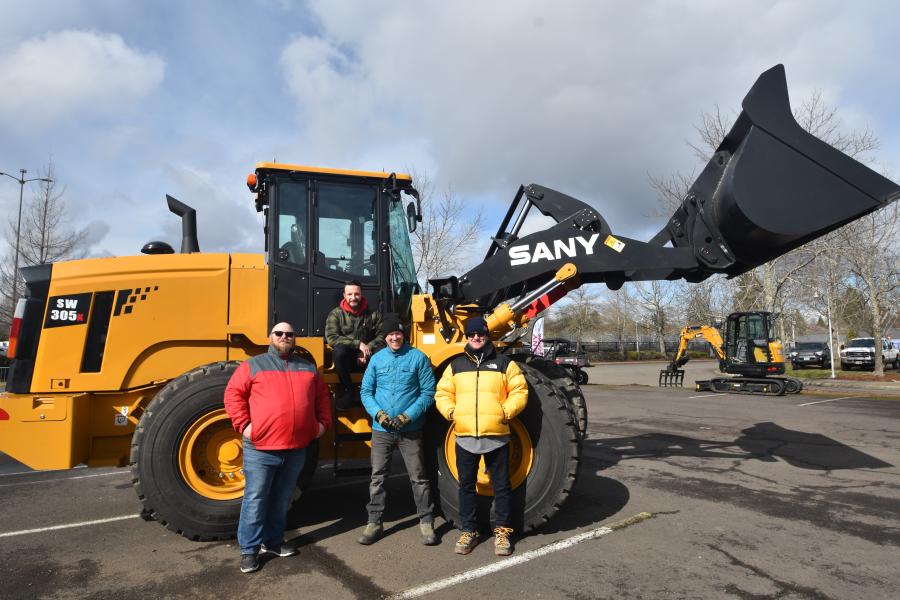 Dustin Rider of SANY with the SANY SW305 wheel loader. He is followed by the NW Equipment team of (L-R): Andrey Volodko, sales; Peter Hostetler, owner; and Harley Brattain, general manager.
(CEG photo)