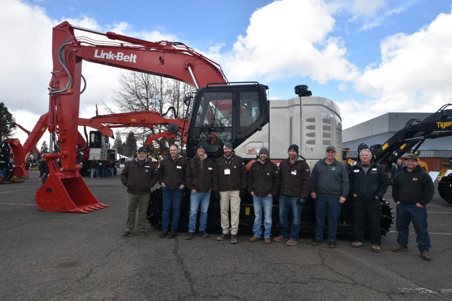 Triad Machinery had an impressive display showcasing its extensive equipment inventory from Link-Belt, including cranes and excavators, as well as a display from TigerCat. (L-R):?Andrew Lundren; Jay McKown; Bruce Caldwell; Ken Schirman; Curtis Beardmore, territory manager; Kevin Putnam; R.L. Smith of Roger Smith Logging; Curt McClure and Kris Hustwaite.
(CEG photo)