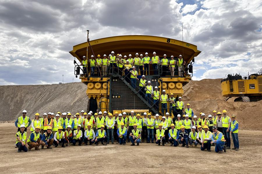 Customers and distributors gathered in front of Komatsu's 980E-5AT truck at the company's Automation Global User Forum at the Komatsu Arizona Proving Grounds (AZPG) facility in Tucson, Ariz.