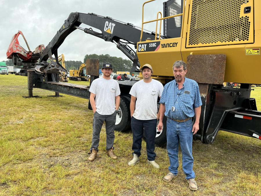 (L-R): Laddie Smith, Hawkins Schirmer and Bill Detyens, all of Shirmer Forestry in Charleston, S.C. This Caterpillat 559C log loader caught their attention and they planned to bid on it.
(CEG photo)