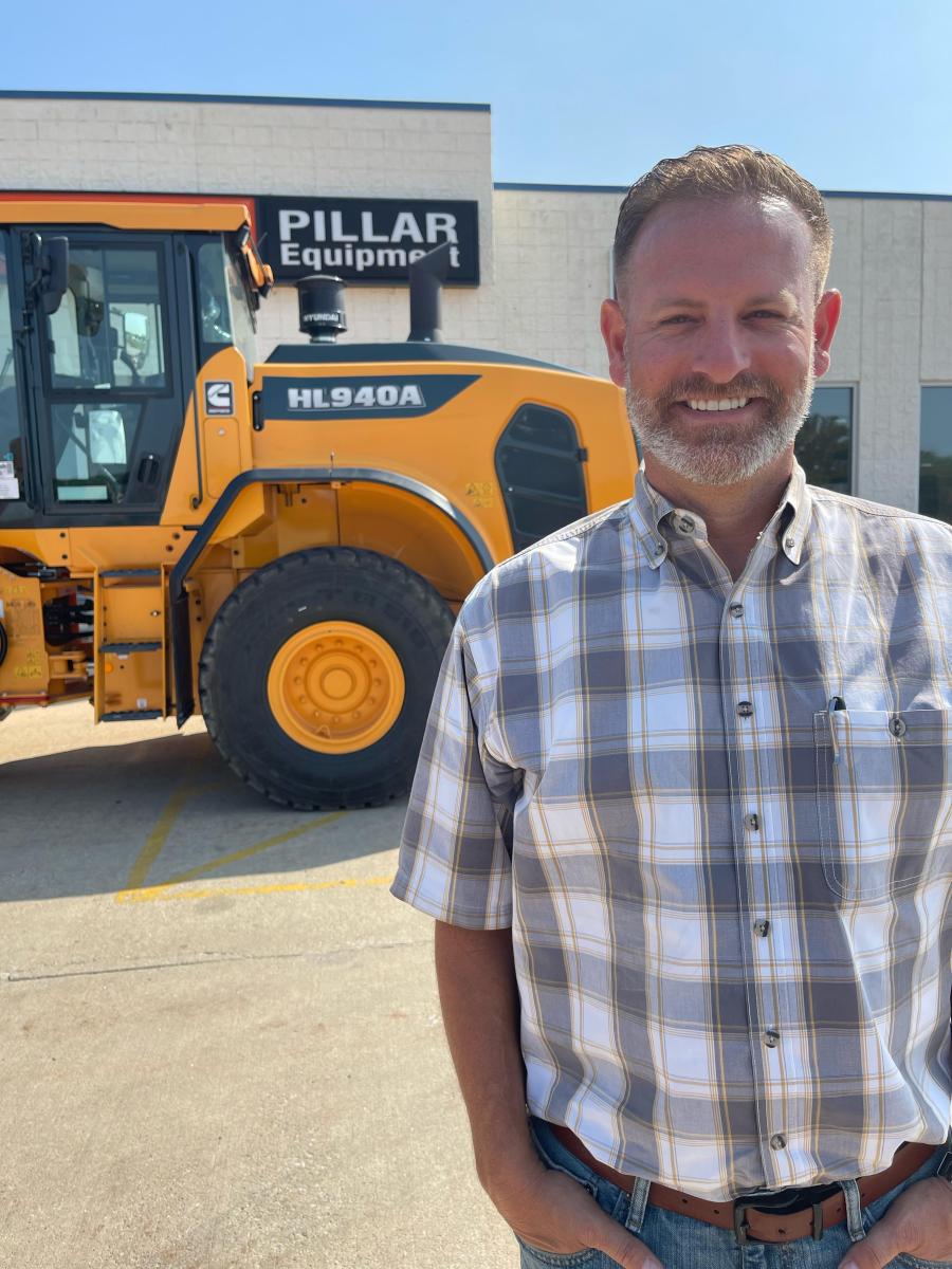 Jason Wentland, owner and founder of Pillar Equipment, poses with a Hyundai HL940A wheel loader outside his dealership in Silvis, Ill. Pillar Equipment recently joined the North American dealer network of Hyundai Construction Equipment Americas.