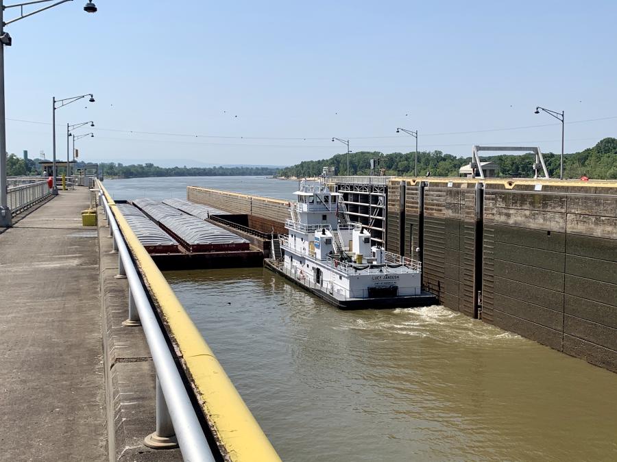 Headed down the Arkansas River, a barge locks through at the Ozark-Jetta Taylor Lock and Dam in Franklin County, Arkansas. Located at mile 308 of the river, the Ozark lock and dam is just one unit of the McClellan-Kerr Arkansas River Navigation System (USACE photo).