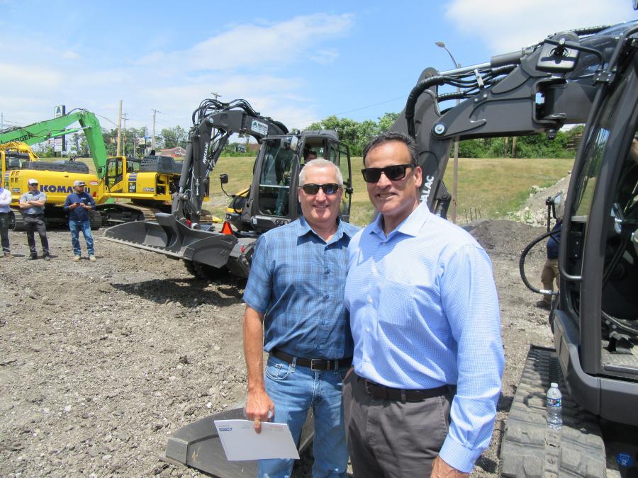Alex E. Paris Contracting Company Equipment Manager Andy Miller (L) caught up with Anderson Equipment Company Account Executive Mike Russo at the demonstration. Miller observed that the Mecalac machines to be extremely well engineered. 
(CEG photo)