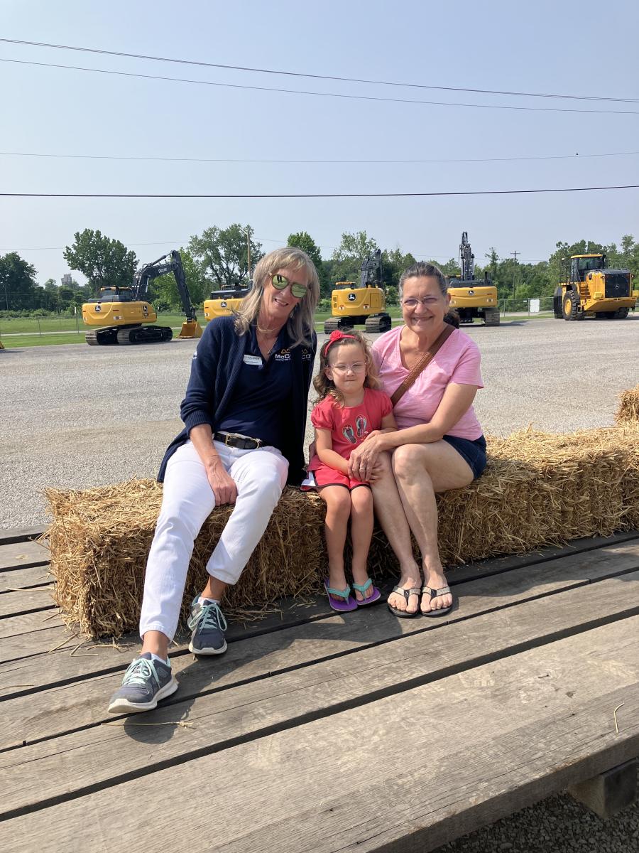 Cape store receptionist Shanna Beaton with friends enjoying a hayride through the machine displays.
(McCoy Construction and Forestry photo)